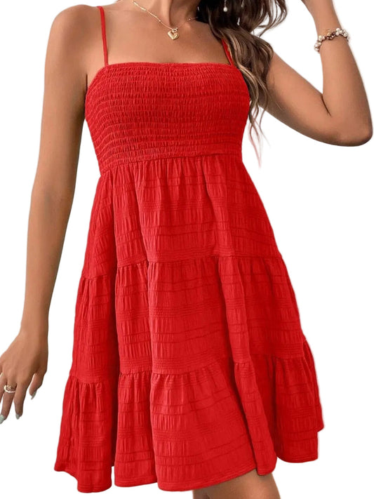 Red dress worn by a person against a white curtain background
